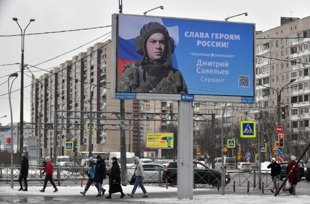 A billboard with a Russian serviceman in Saint Petersburg and the slogan: "Glory to the He