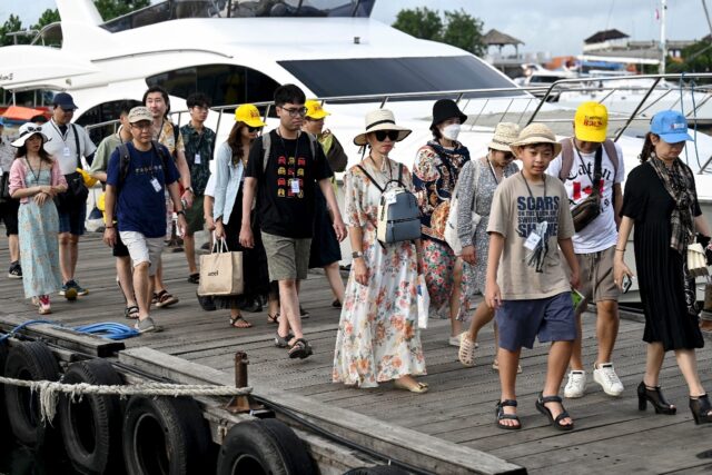 Chinese tourists have returned to Indonesia's resort island of Bali after borders at home