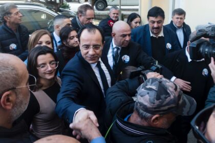 Former Cyprus foreign minister and presidential candidate Nikos Christodoulides greets sup