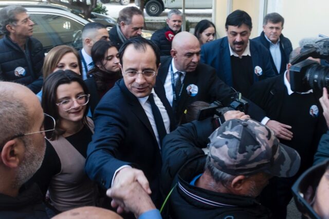 Former Cyprus foreign minister and presidential candidate Nikos Christodoulides greets sup