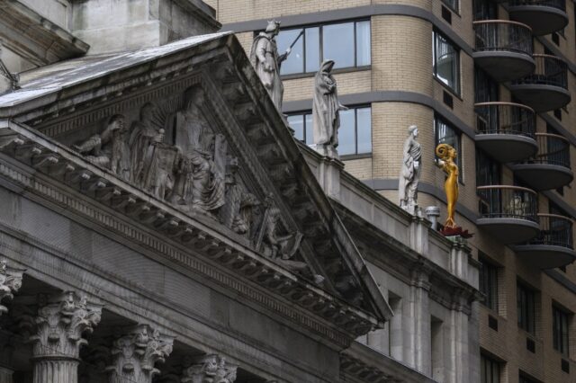 Shahzia Sikander’s sculpture “Now” (R) stands atop a New York courthouse as part of