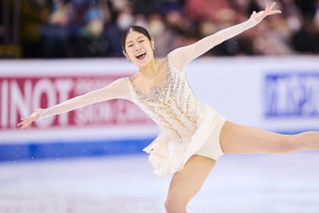 South Korea's Lee Hae-in smiles as she lands a jump in her free skate on the way to victor