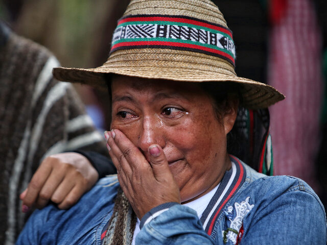 An Indigenous woman cries during the funeral of Indigenous leader Albeiro Camayo in Buenos