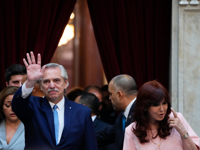 Argentine President Alberto Fernandez waves as he arrives to the Congress to address the nation with Vice President Cristina Fernandez at the annual opening legislative session in Buenos Aires, Argentina, Wednesday, March 1, 2023. (AP Photo/Natacha Pisarenko)