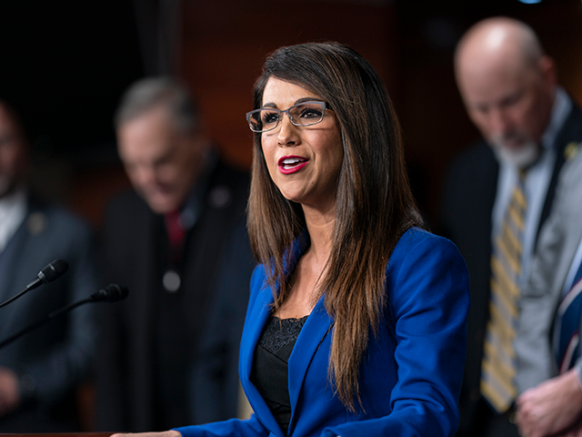 Rep. Lauren Boebert, R-Colo., center, joins other members of the House Freedom Caucus as she speaks during a press conference at the Capitol in Washington, Friday, March 10, 2023. (AP Photo/J. Scott Applewhite)