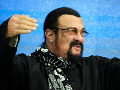 Steven Seagal, the American action-movie actor who also holds Russian citizenship gestures during a ceremony to open the Founding Congress of the International Russophile Movement at the Pushkin State Museum in Moscow, Russia, Tuesday, March 14, 2023. Russian President Vladimir Putin sent his greetings to the participants and guests of …