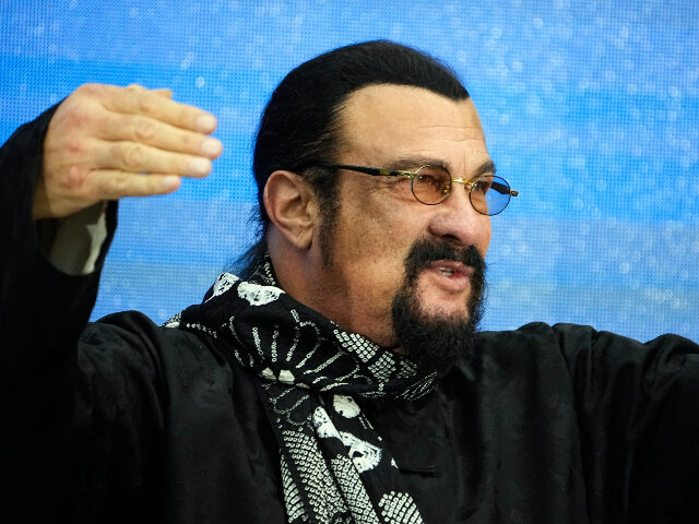 Steven Seagal, the American action-movie actor who also holds Russian citizenship gestures