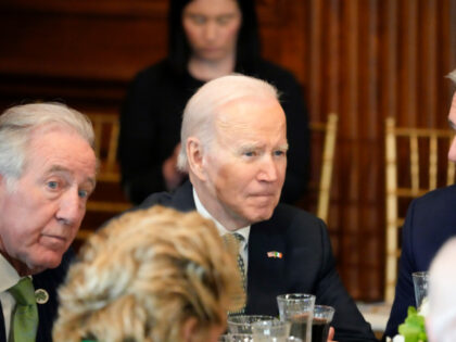 House Speaker Kevin McCarthy of Calif., right, speaks with President Joe Biden during a Friends of Ireland Caucus St. Patrick's Day luncheon at the U.S. Capitol, Friday, March 17, 2023, in Washington. Rep. Richard Neal, D-Mass., is at left. (AP Photo/Alex Brandon)
