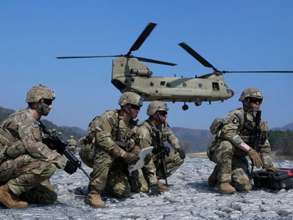 U.S. Army soldiers wait to board their CH-47 Chinook helicopter during a joint military drill between South Korea and the United States at Rodriguez Live Fire Complex in Pocheon, South Korea, Sunday, March 19, 2023. North Korea launched a short-range ballistic missile toward the sea on Sunday, its neighbors said, …