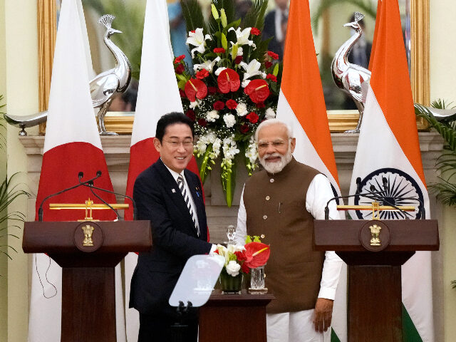 Japan’s Prime Minister Fumio Kishida, left and Indian Prime Minister Narendra Modi, shake hands after making press statements following their meeting in New Delhi, India, Monday, March 20, 2023. (AP Photo/Manish Swarup)