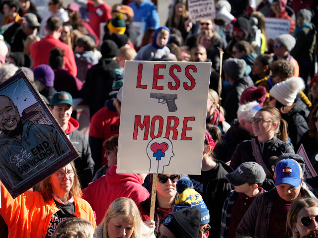 Students and parents from schools across Colorado take part in a rally calling for state lawmakers to consider gun control measures during the current legislative session Friday, March 24, 2023, outside the State Capitol in Denver. (AP Photo/David Zalubowski)