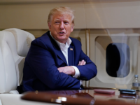 Former President Donald Trump speaks with reporters while in flight on his plane after a campaign rally at Waco Regional Airport, in Waco, Texas, March 25, 2023, while en route to West Palm Beach, Fla. As Trump rails against possible indictment in New York, his team is leaning into a strategy that has quietly become a become a cornerstone of his campaign: releasing made-for-social media videos reacting to the news and outlining his agenda for a second term. (AP Photo/Evan Vucci)