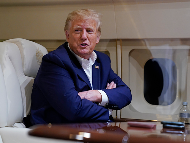 Former President Donald Trump speaks with reporters while in flight on his plane after a campaign rally at Waco Regional Airport, in Waco, Texas, March 25, 2023, while en route to West Palm Beach, Fla. As Trump rails against possible indictment in New York, his team is leaning into a …