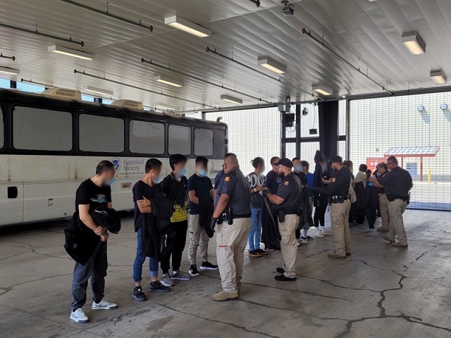 RGV agents prepare to load a group of Chinese migrants onto a bus for processing. (U.S. Border Patrol/Rio Grande Valley Sector)
