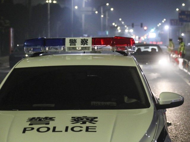 HUAI'AN, CHINA - JANUARY 10, 2022 - Traffic policemen check passing cars for drunk dr