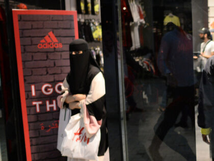 A woman wearing a Niqab leaving the Adidas store at the Villaggio shopping mall in Doha, 08 January 2016. Jerseys of German football club FC Bayern Munich are displayed in the window. PHOTO: ANDREAS GEBERT/DPA | usage worldwide (Photo by Andreas Gebert/picture alliance via Getty Images)