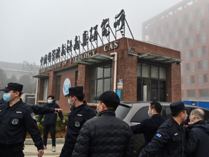 Members of the World Health Organization (WHO) team investigating the origins of the COVID-19 coronavirus, arrive at the Wuhan Institute of Virology in Wuhan, in China's central Hubei province on February 3, 2021. (Photo by Hector RETAMAL / AFP) (Photo by HECTOR RETAMAL/AFP via Getty Images)