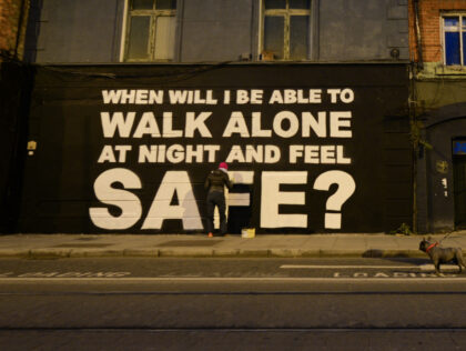 Irish artist Emmalene Blake working on her latest mural in Dublin's city centre during level 5 COVID-19 lockdown. The inscription 'When will I be able to walk alone at night and feel safe?' relates to violence against women. On Saturday, March 27, 2021, in Dublin, Ireland. (Photo by Artur Widak/NurPhoto …
