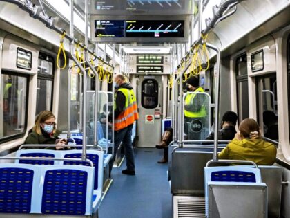 People take a train with 7000-series railcars during an in-service test run in Chicago, the United States, on May 6, 2021. Assembled by China Railway Rolling Stock Corporation CRRC Sifang America Incorporated in Chicago, the eight railcars, part of the first batch of the 10 7000-series railcars CRRC Sifang America …