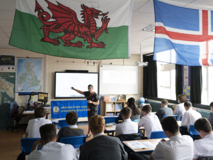 CARDIFF, WALES - SEPTEMBER 14: Pupils listen during a geography lesson at Whitchurch High School on September 14, 2021 in Cardiff, Wales. All children aged 12 to 15 across the UK will be offered a dose of the Pfizer-BioNTech Covid-19 vaccine. Parental consent will be sought for the schools-based vaccination …