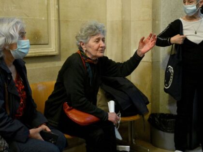 Former members of Italy's far-left group Brigate Rosse (Red Brigades) Marina Petrella (C) talks with people as she waits for the start of a hearing before the Paris court of appeal examining the extradition requests of nine former activists wanted by Italy for terrorism, in Paris on April 20, 2022. …