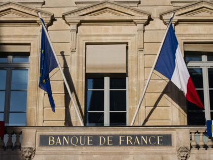 The flags of France and the European Union (EU) outside the headquarters of France's