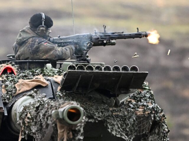 A soldier fires from a Leopard 2 tank at the training ground in Augustdorf, western German