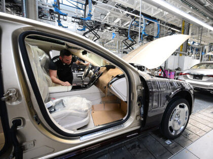 PRODUCTION - 13 February 2023, Baden-Württemberg, Sindelfingen: Employees of the Stuttgart-based car manufacturer Mercedes-Benz work on the production line for luxury and luxury-class vehicles in Factory 56 at the Merecdes-Benz plant in Sindelfingen. In addition to the EQS, all variants of the Mercedes-Benz S-Class and the Mercedes-Maybach S-Class come off …