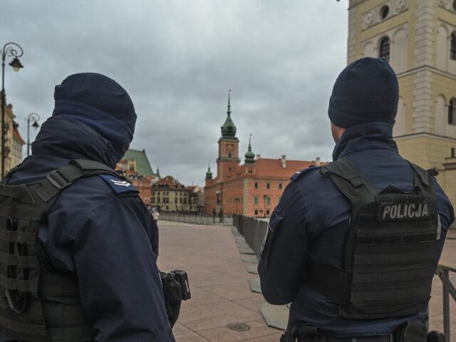 WARSAW, POLAND - FEBRUARY 21: Police officers securing Krakowskie Przedmiescie Street, whe