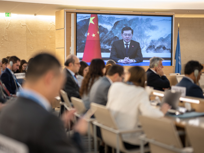 Chinas Foreign Minister Qin Gang is seen on a giant screen as he gives a speech by video message during the 52nd UN Human Rights Council session, in Geneva, on February 17, 2023. (Photo by Fabrice COFFRINI / AFP) (Photo by FABRICE COFFRINI/AFP via Getty Images)