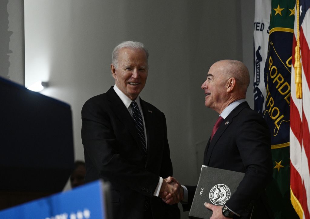 President Joe Biden greets Homeland Security Secretary (DHS) Alejandro Mayorkas as he arrives to speak at the DHS 20th Anniversary Ceremony at DHS headquarters in Washington, DC, March 1, 2023. (BRENDAN SMIALOWSKI/AFP via Getty Images)