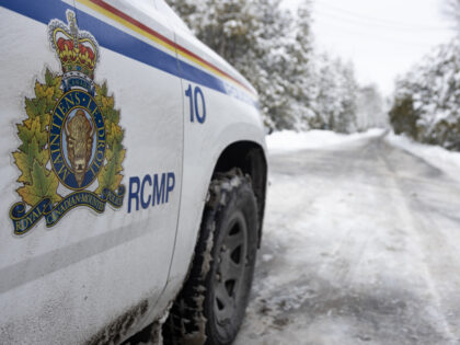 A Royal Canadian Mounted Police (RCMP) car along Roxham Road in Saint-Bernard-de-Lacolle, Quebec, Canada, on Sunday, March 5, 2023. Ahead of US President Joe Biden's visit to Canada later this month, Quebec Premier Francois Legault is trying to draw attention to the hundreds of migrants a day coming via a …