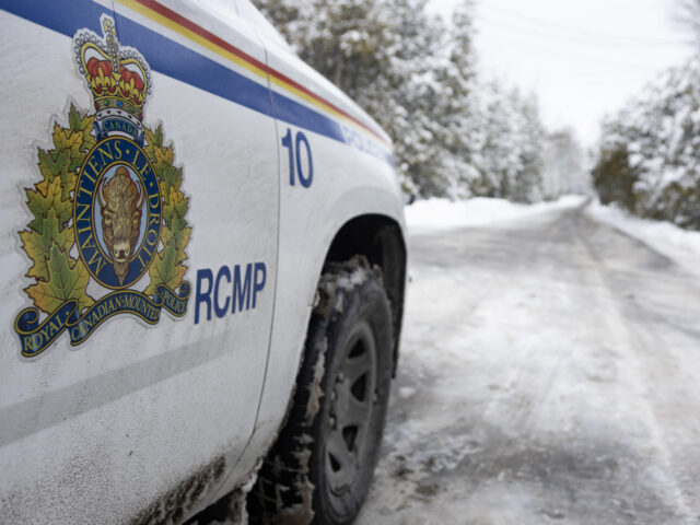 A Royal Canadian Mounted Police (RCMP) car along Roxham Road in Saint-Bernard-de-Lacolle,