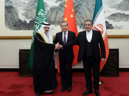 Iran's top security official Ali Shamkhani (R), Chinese Foreign Minister Wang Yi (C) and Musaid Al Aiban, the Saudi Arabia's national security adviser pose for a photo after Iran and Saudi Arabia have agreed to resume bilateral diplomatic ties after several days of deliberations between top security officials of the …