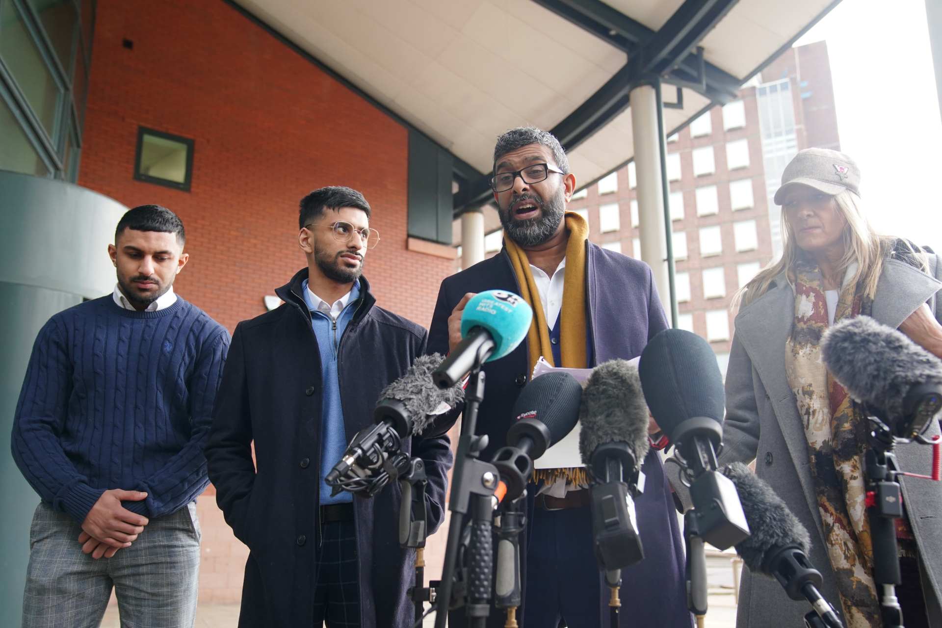 Mohammed Ramzan (second right), who was accused of trafficking by Eleanor Williams, with Nicola Holt (right), outside Preston Crown Court, Lancashire, where Williams was jailed for eight-and-a-half years for nine counts of perverting the course of justice after she claimed to have been the victim of an Asian grooming gang. Williams, 22, published pictures of her injuries and an account of being groomed, trafficked and beaten, on Facebook in May 2020, in a post which was shared more than 100,000 times. Picture date: Tuesday March 14, 2023. (Photo by Peter Byrne/PA Images via Getty Images)
