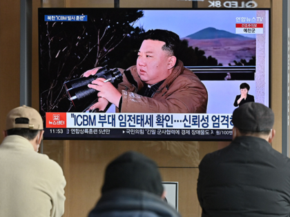 People watch a television news screen showing a picture of North Korea's leader Kim Jong Un witnessing the recent test-firing of a Hwasong-17 intercontinental ballistic missile (ICBM), at a railway station in Seoul on March 17, 2023. - North Korea said the projectile it test-fired on March 16 was an …