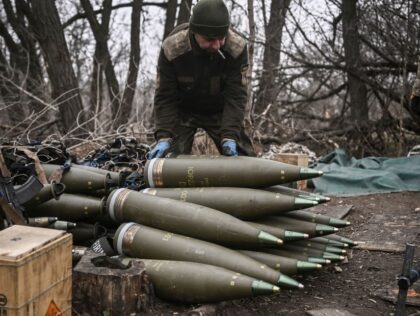 A Ukrainian serviceman prepares 155mm artillery shells near Bakhmut, eastern Ukraine, on M
