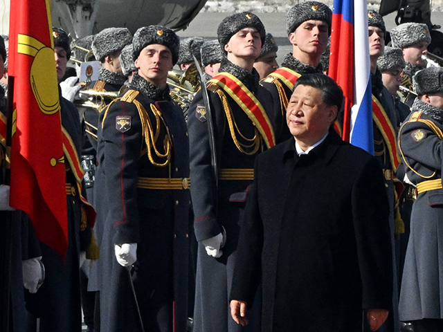China's President Xi Jinping walks past honour guards during a welcoming ceremony at Moscow's Vnukovo airport on March 20, 2023. - Chinese leader arrived in Moscow on Monday saying his first state visit to Russia since the Ukraine conflict broke out would give "new momentum" to bilateral ties. (Photo by Anatoliy Zhdanov / Kommersant Photo / AFP) / Russia OUT (Photo by ANATOLIY ZHDANOV/Kommersant Photo/AFP via Getty Images)