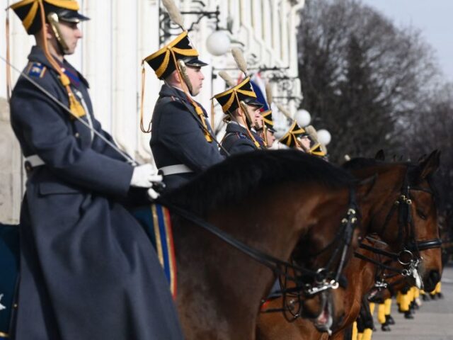 Russian horse-mounted honour guards get ready for the arrival of Chinese President and mem