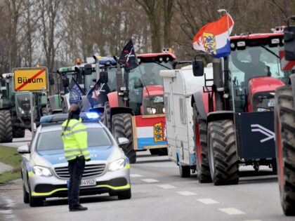 22 March 2023, Schleswig-Holstein, Büsum: Participants of a protest meeting of farmers with their tractors arrive him a demonstration procession before the start of the conference of agriculture ministers in Büsum. At the March 22-24 conference, federal and state agriculture ministers will meet for their deliberations. According to the Ministry …