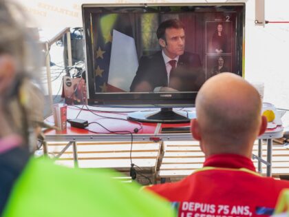 Striking members of the General Confederation of Labour (CGT) watch a television interview with French President Emmanuel Macron, while blocking the road to the EPPLN oil depot in Port La Nouvelle, France, on Wednesday, March 22, 2023. Macron doubled down on his plan to reform pensions, comparing protesters to the …