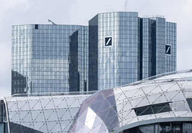 22 March 2023, Hesse, Frankfurt/Main: Deutsche Bank towers over the houses in Frankfurt's city center. Photo: Boris Roessler/dpa (Photo by Boris Roessler/picture alliance via Getty Images)
