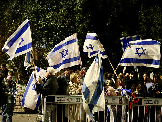 A group of Israelis gather in front of the Israeli Presidential Residence to protest the negotiations between government and opposition, in West Jerusalem on March 28, 2023. (Photo by Mostafa Alkharouf/Anadolu Agency via Getty Images)