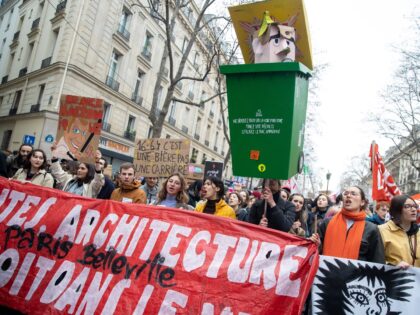 PARIS, FRANCE - 2023/03/28: Protesters hold placards, and banners as they chant slogans du