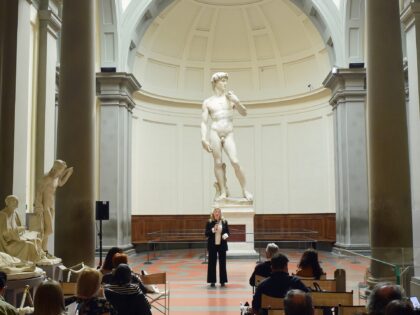 FLORENCE, ITALY - MAY 02: A visitor admires the David statue by italian rinascimental artist Michelangelo Buonarroti during the presentation of the celebrations for the 140th anniversary of the placement at the Gallerie dall'Accademia on May 02, 2022 in Florence, Italy. (Photo by Roberto Serra - Iguana Press/Getty Images)