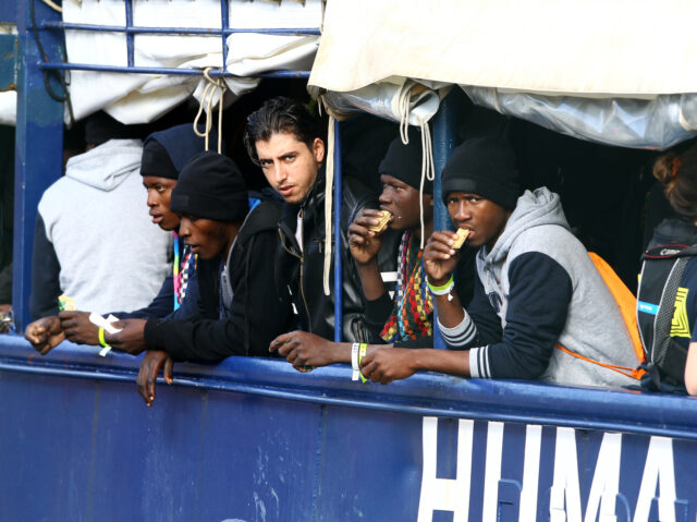 BARI, ITALY - DECEMBER 11: Migrants waiting for the usual checks after arriving on the Hum