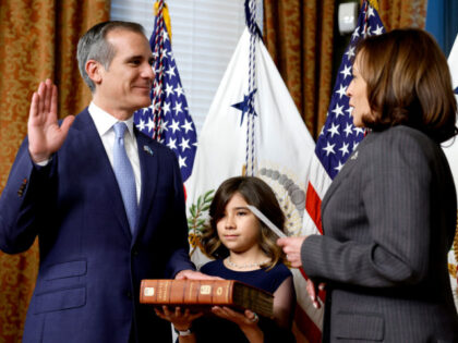 WASHINGTON, DC - MARCH 24: U.S. Vice President Kamala Harris ceremonially swears in Eric Garcetti as Ambassador to India alongside his daughter Maya Garcetti at the Eisenhower Executive Office Building on March 24, 2023 in Washington, DC. Garcetti previously served as the mayor of Los Angeles, California from 2013 to …