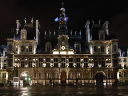 A night picture of the famous building Hotel de Ville in Paris.