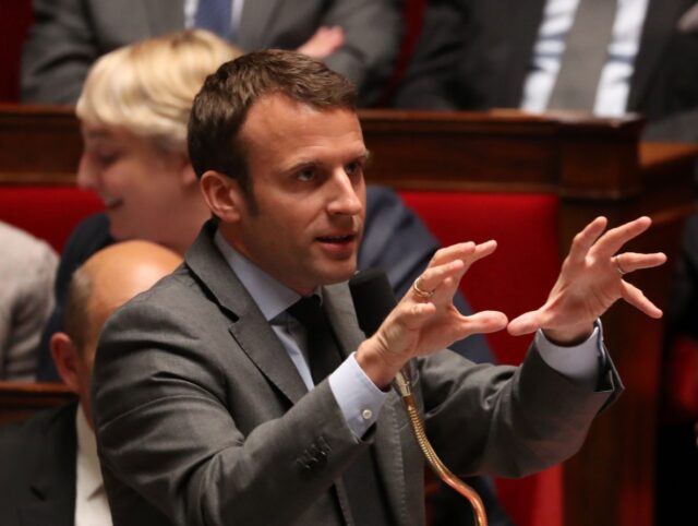 French Economy and Industry minister Emmanuel Macron gestures as he speaks during a sessio