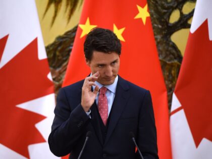 Canadian Prime Minister Justin Trudeau reacts during a press conference with Chinese Premi